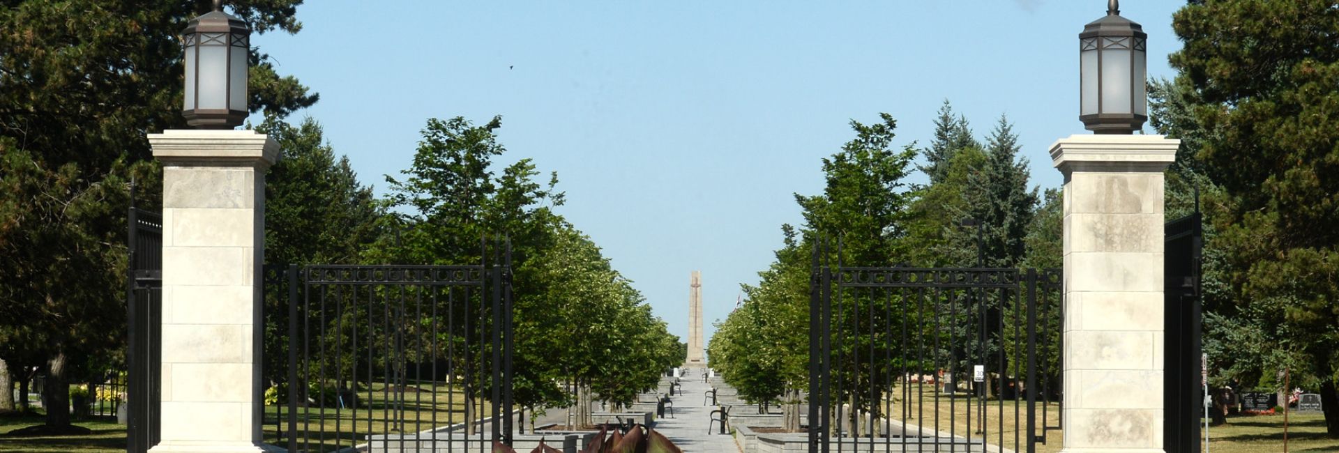 Peaceful view of York Cemetery and Funeral Centre, highlighting its tranquil grounds, mature trees, and historic memorials. York Cemetery and Funeral Centre gate