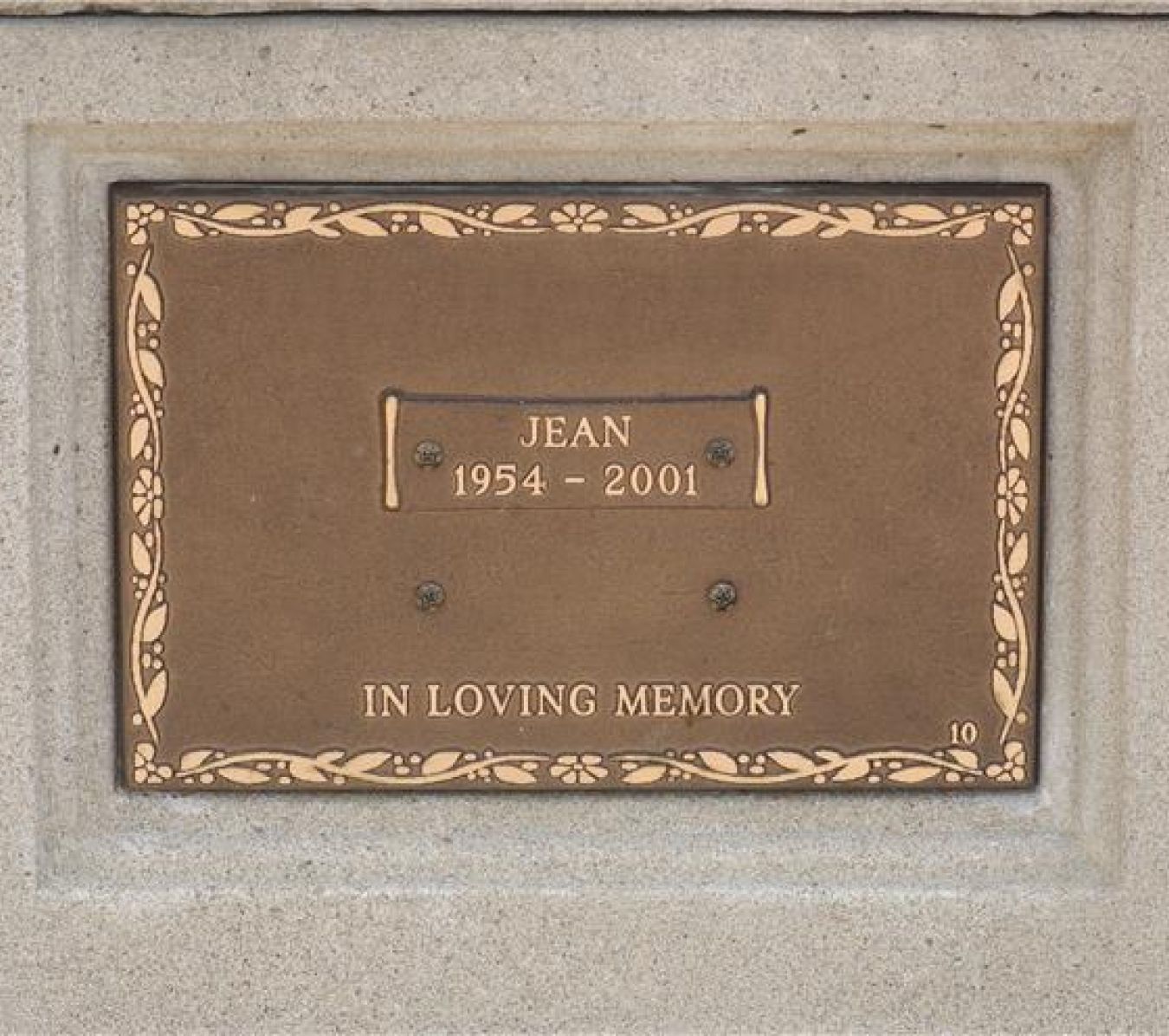 plaque with a name and a year of birth and death