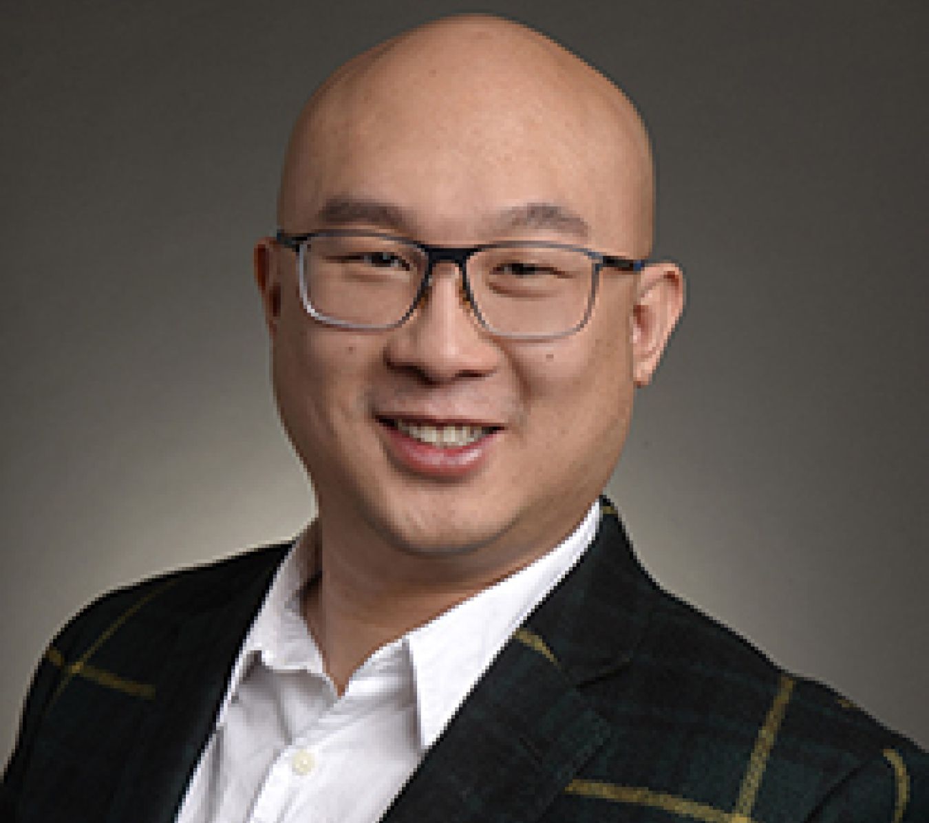 bald asian man with glasses